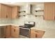 Modern kitchen with light wood cabinets, chevron backsplash and stainless steel appliances at 1804 Piccolo Way, Las Vegas, NV 89146