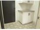 Updated laundry room with patterned flooring and cabinets at 1804 Piccolo Way, Las Vegas, NV 89146