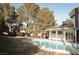 Home's backyard features a kidney-shaped pool and spa at 1804 Piccolo Way, Las Vegas, NV 89146