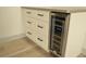 Stylish wine cooler and cabinets add convenient storage at 1804 Piccolo Way, Las Vegas, NV 89146