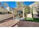 Landscaped backyard with pergola and swing at 1805 Grand Rodeo St, Las Vegas, NV 89117