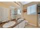 Bathroom boasts double sinks, granite countertops, and a shower/tub combo at 1805 Grand Rodeo St, Las Vegas, NV 89117