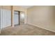 Bedroom with mirrored closet doors and neutral colored carpet at 1805 Grand Rodeo St, Las Vegas, NV 89117