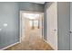 View of a bedroom from hallway, featuring carpeted floor and neutral walls at 1805 Grand Rodeo St, Las Vegas, NV 89117