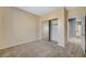 Well-lit bedroom with mirrored closet and access to hallway at 1805 Grand Rodeo St, Las Vegas, NV 89117