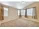 Spacious bedroom with vaulted ceilings, carpeting, and ample natural light at 1805 Grand Rodeo St, Las Vegas, NV 89117