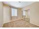 Upstairs bedroom with mirrored closet and window at 1805 Grand Rodeo St, Las Vegas, NV 89117