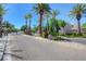 Gated community entrance with palm trees and brick pavers at 1805 Grand Rodeo St, Las Vegas, NV 89117