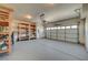 Garage with overhead door, and built-in shelving at 1805 Grand Rodeo St, Las Vegas, NV 89117