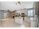 Spacious kitchen with island, stainless steel appliances, and light wood flooring at 1805 Grand Rodeo St, Las Vegas, NV 89117