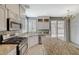 Modern kitchen featuring stainless steel appliances and granite countertops at 1805 Grand Rodeo St, Las Vegas, NV 89117