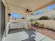 Covered patio with outdoor kitchen and ceiling fan at 1805 Grand Rodeo St, Las Vegas, NV 89117