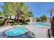 Community pool and spa with surrounding landscaping at 1805 Grand Rodeo St, Las Vegas, NV 89117