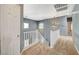 Upstairs hallway with gray walls and white railing at 1805 Grand Rodeo St, Las Vegas, NV 89117