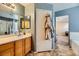 Bathroom with a double vanity and view of the bedroom at 2210 Cool River Ct, North Las Vegas, NV 89032