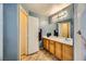 Bathroom with a double vanity and linen closet at 2210 Cool River Ct, North Las Vegas, NV 89032