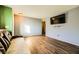 Living room with wood-look floors and a couch at 2210 Cool River Ct, North Las Vegas, NV 89032