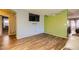 Living room featuring wood-like flooring and a flat-screen TV at 2210 Cool River Ct, North Las Vegas, NV 89032