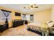 Spacious main bedroom with a dresser, large bed, and ensuite bathroom at 2210 Cool River Ct, North Las Vegas, NV 89032