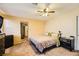 Main bedroom with a large bed, dresser, and access to the bathroom at 2210 Cool River Ct, North Las Vegas, NV 89032