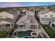 Aerial view of house with pool and spa; desert landscape at 2465 Sturrock Dr, Henderson, NV 89044