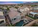 Aerial view of house, pool, and surrounding neighborhood at 2465 Sturrock Dr, Henderson, NV 89044