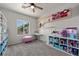 bedroom with colorful storage, a window, and gray carpeting at 2465 Sturrock Dr, Henderson, NV 89044