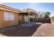 Covered patio and spacious backyard with gravel at 2535 River Oaks Dr, Las Vegas, NV 89156