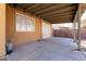 Covered patio and backyard with a concrete slab at 2535 River Oaks Dr, Las Vegas, NV 89156