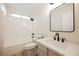 Bathroom boasts modern vanity and a bathtub shower combo at 2670 Zephyr Ave, Pahrump, NV 89048