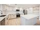 Modern kitchen with white cabinets, quartz countertops, and stainless steel appliances at 2670 Zephyr Ave, Pahrump, NV 89048