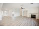 Living room with fireplace, built-in shelves, and light wood floors at 2670 Zephyr Ave, Pahrump, NV 89048