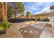 Covered patio and spacious backyard with gravel at 2674 Alwoodley Cir, Las Vegas, NV 89142