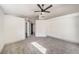 Spacious bedroom with ceiling fan and barn door to bathroom at 2674 Alwoodley Cir, Las Vegas, NV 89142