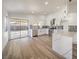 Modern kitchen with white cabinets, quartz countertops, and stainless steel appliances at 2674 Alwoodley Cir, Las Vegas, NV 89142