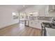 Modern kitchen with white cabinets and stainless steel appliances at 2674 Alwoodley Cir, Las Vegas, NV 89142