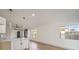 Modern kitchen island with white cabinets and quartz countertops at 2674 Alwoodley Cir, Las Vegas, NV 89142