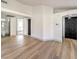 Living room with light wood floors and a modern fireplace at 2674 Alwoodley Cir, Las Vegas, NV 89142