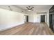 Bright living room featuring wood-look floors and a ceiling fan at 2674 Alwoodley Cir, Las Vegas, NV 89142