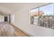 Bright living room featuring hardwood floors and large windows at 2674 Alwoodley Cir, Las Vegas, NV 89142