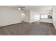 Spacious living room with grey carpet and ceiling fan at 2728 Pavehawk Way, Las Vegas, NV 89156