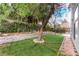 Private backyard with mature trees and walkway at 2849 Huber Heights Dr, Las Vegas, NV 89128