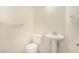 Small bathroom with pedestal sink, toilet, and shower at 2849 Huber Heights Dr, Las Vegas, NV 89128