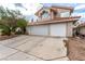 Two-story house with three-car garage and Spanish tile roof at 2849 Huber Heights Dr, Las Vegas, NV 89128