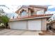 Two-story house with three-car garage and Spanish tile roof at 2849 Huber Heights Dr, Las Vegas, NV 89128