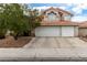 Two-story house with three-car garage and Spanish tile roof at 2849 Huber Heights Dr, Las Vegas, NV 89128