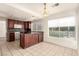 Kitchen features dark wood cabinets, granite countertops, and a breakfast nook at 2849 Huber Heights Dr, Las Vegas, NV 89128