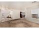 Living room features carpet flooring and a view of the kitchen and staircase at 2849 Huber Heights Dr, Las Vegas, NV 89128