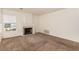 Living room with fireplace, carpet, and large window providing natural light at 2849 Huber Heights Dr, Las Vegas, NV 89128