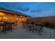 Backyard patio with seating area, fountain, and lighting at night at 3361 Winery Rd, Pahrump, NV 89048